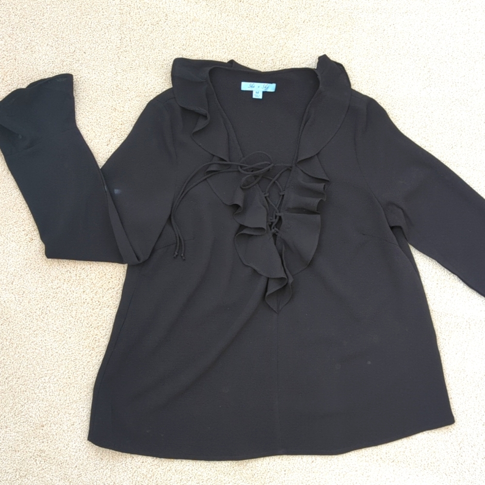 Black long sleeve ruffle top with lace-up tie neck